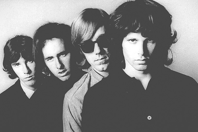 Members of The Doors pose for an undated publicity photo from files. Frontman Jim Morrison (far right( died in 1971 at age 27. (AP Photo/File)
