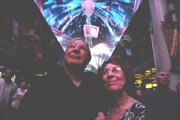 Lee and Shirley Bauer of Rapid City, S.D., watch as “The Doors: Strange Days in Vegas” plays on the huge screen at the Fremont Street Experience in downtown Las Vegas. Complex math formulas were used to make this canopy show more high-tech than previous shows.