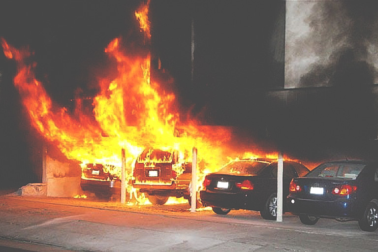 Burning cars are shown at the site of an arson fire in the Hollywood section of Los Angeles on Friday Dec.30, 2011. An arsonist torched car after car early Friday, sending firefighters scrambling to put out more than a dozen blazes in Hollywood and neighboring West Hollywood. CREDIT: Photo: AP / MIKE MEADOWS